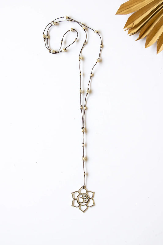 Raw Moda Floral Ohm Alloy Necklace – styled on model with boho outfit